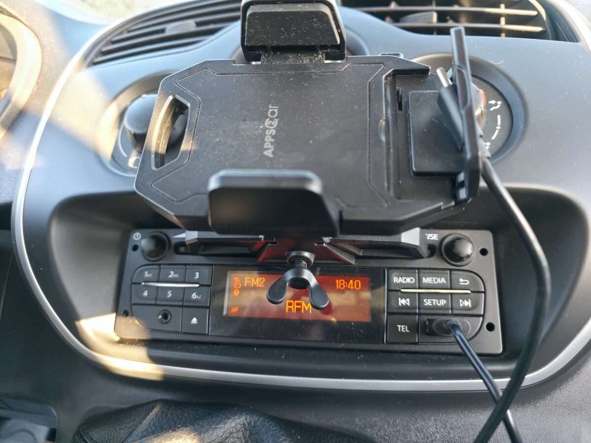 Steering wheel, dashboard and phone holder